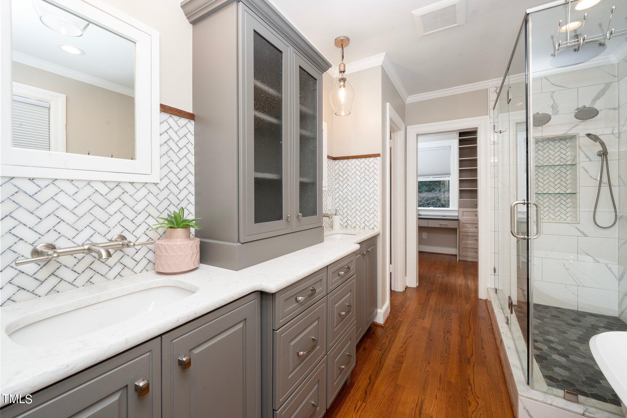 406 Brooks Avenue Raleigh, NC 27607 - Photo 20 of 33 a spacious bathroom with a granite countertop sink and a shower