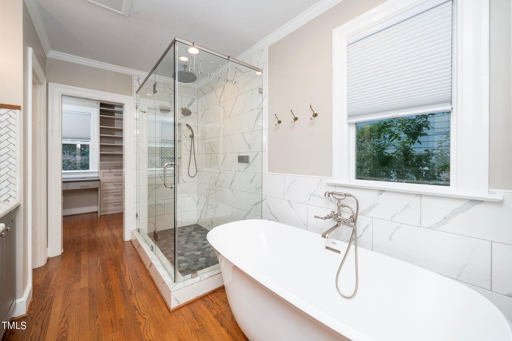 406 Brooks Avenue Raleigh, NC 27607 - Photo 21 of 33 a bathroom with a bathtub and a shower