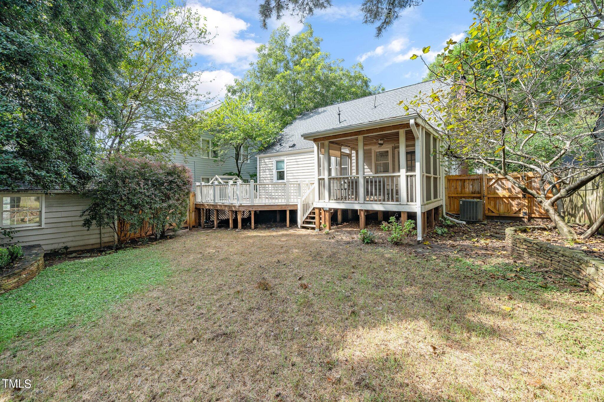 406 Brooks Avenue Raleigh, NC 27607 - Photo 31 of 33 a view of a house with a yard and large tree