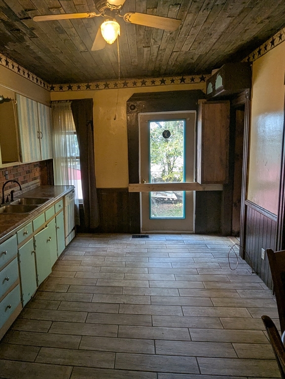 124 Fish Street Athol, MA 01331 - Photo 4 of 20 a kitchen with granite countertop a refrigerator and a sink