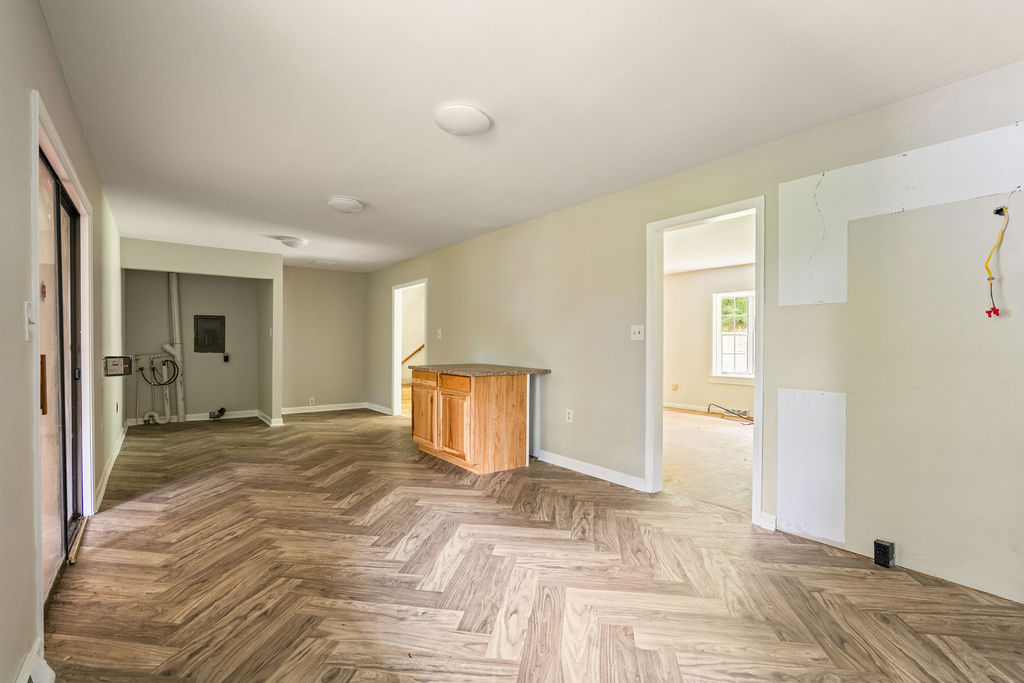 712 Whitney Way Anderson, SC 29625 - Photo 15 of 31 Herringbone pattern wood-look flooring defines this versatile space, ready for your personal touch.