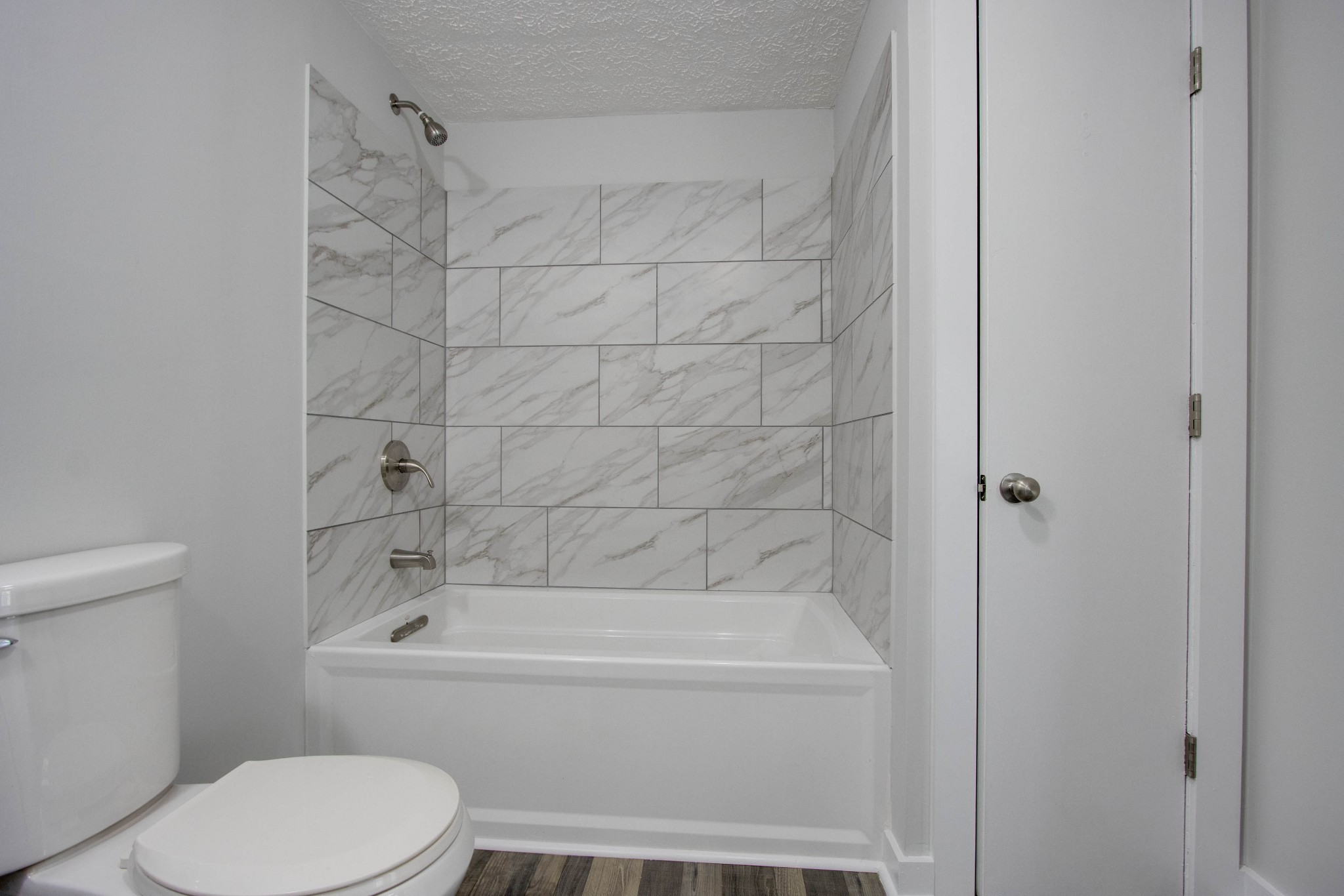 424 Austin Lake Road Baxter, TN 38544 - Photo 18 of 31 a bathroom with a toilet and shower