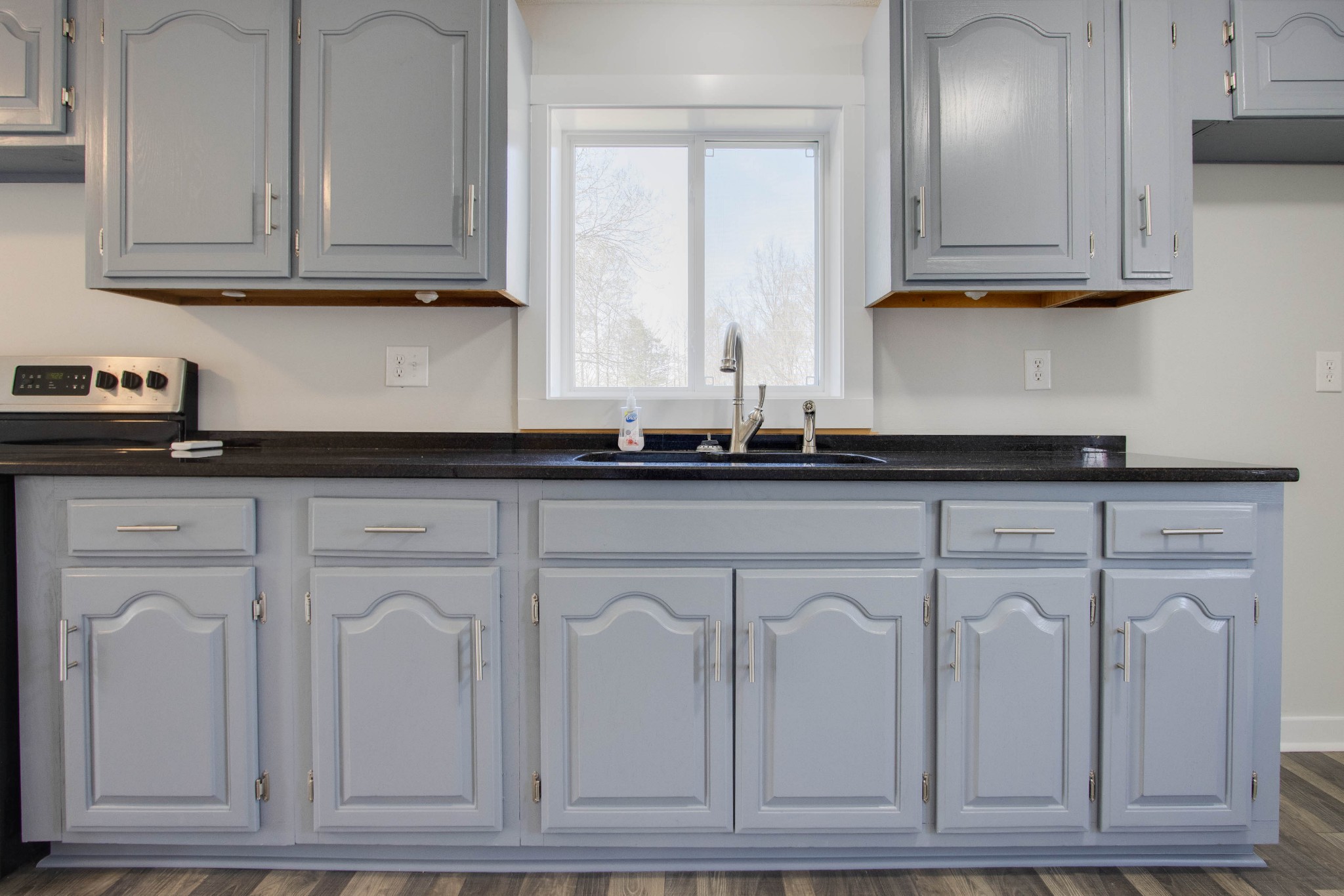 424 Austin Lake Road Baxter, TN 38544 - Photo 19 of 31 a kitchen with white cabinets and sink