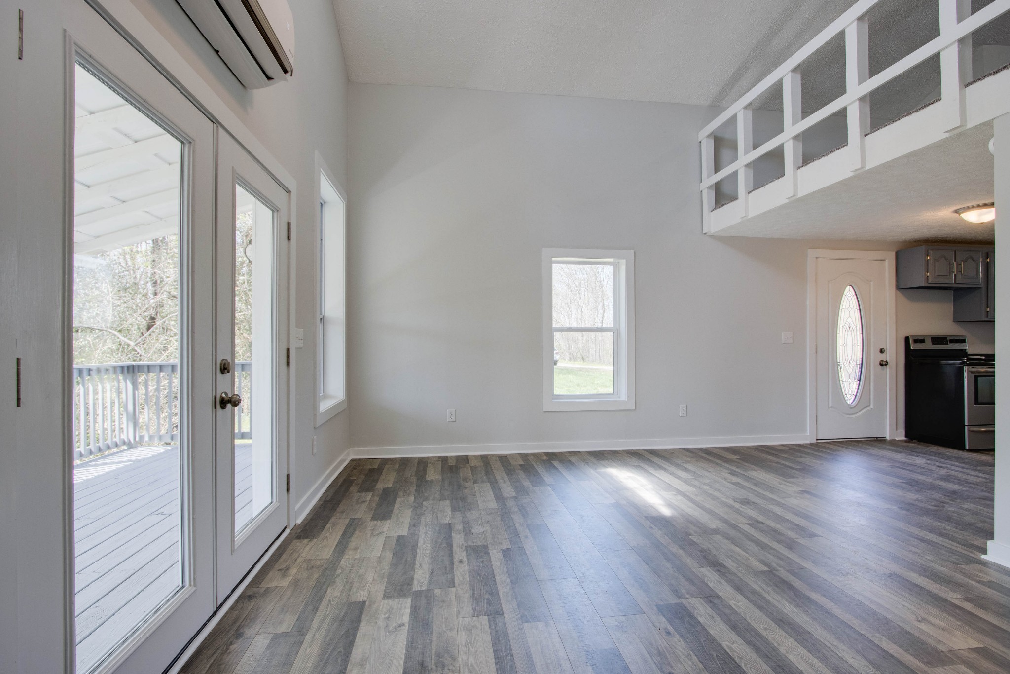 424 Austin Lake Road Baxter, TN 38544 - Photo 21 of 31 a view of an empty room with wooden floor and a window