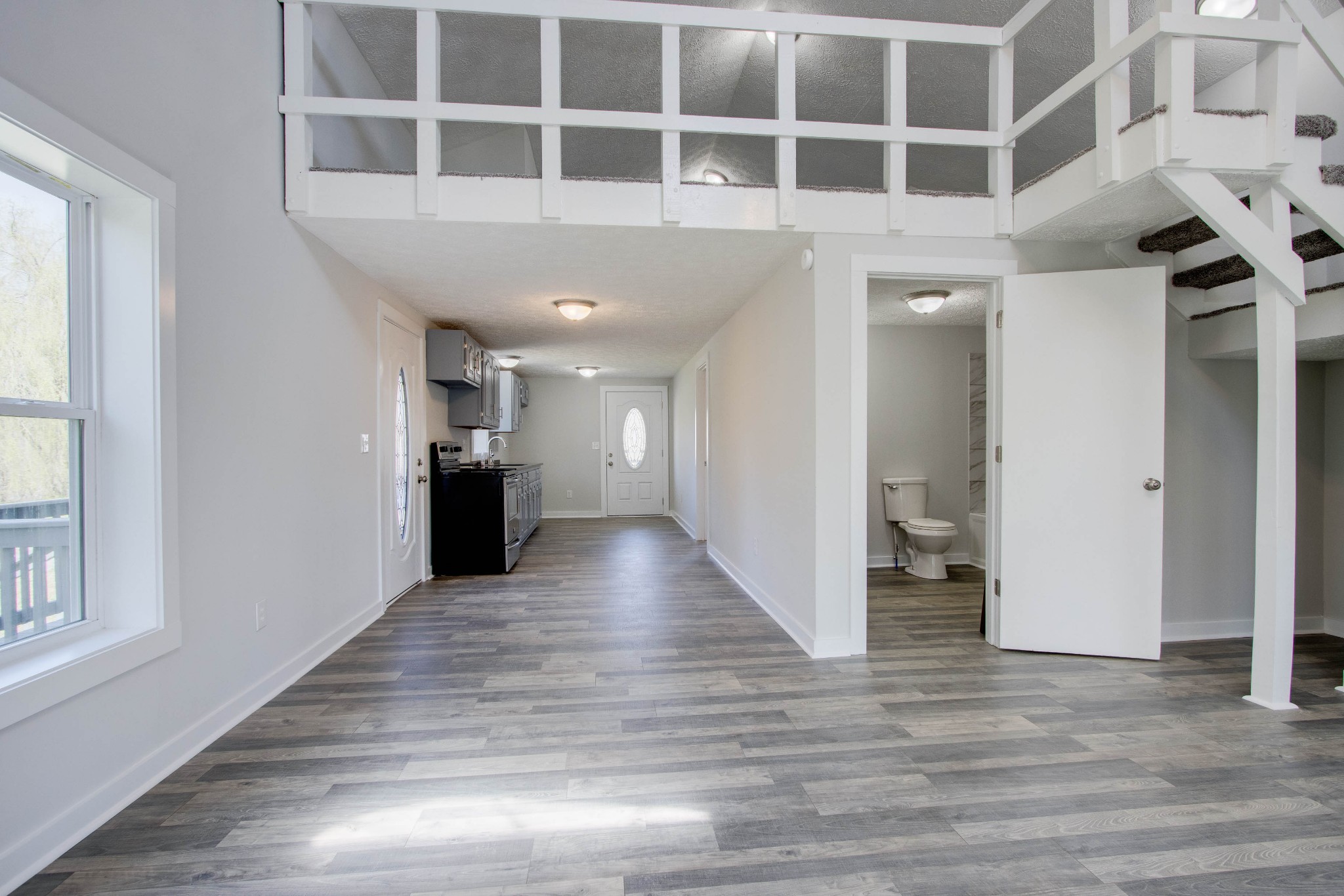 424 Austin Lake Road Baxter, TN 38544 - Photo 29 of 31 a view of a hallway with wooden floor and staircase