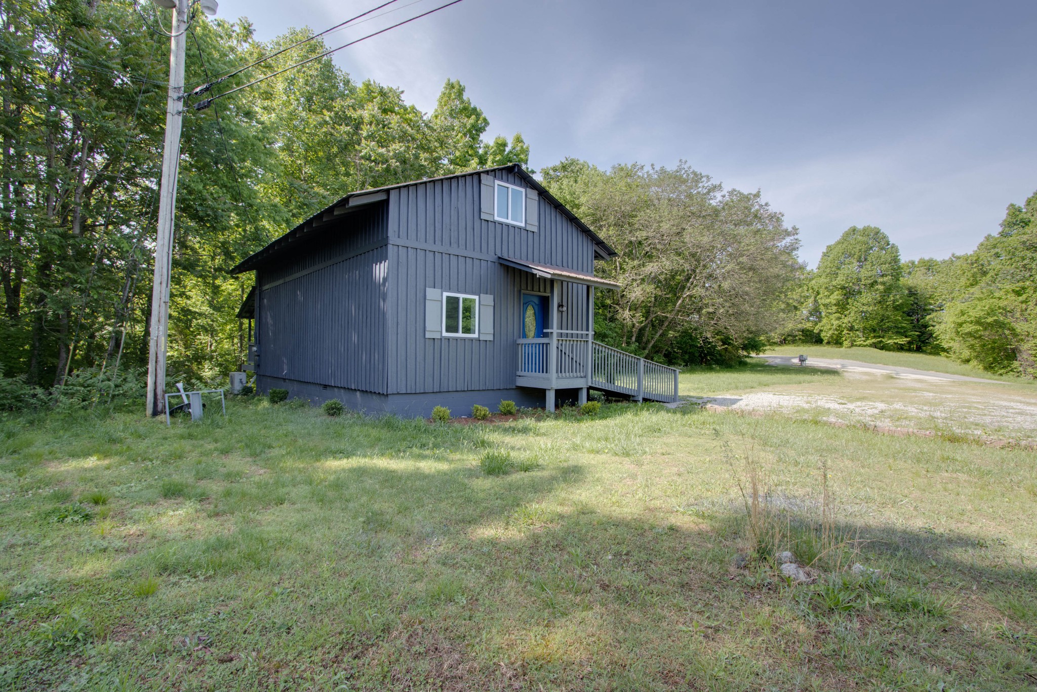 424 Austin Lake Road Baxter, TN 38544 - Photo 7 of 31 a house with trees in the background
