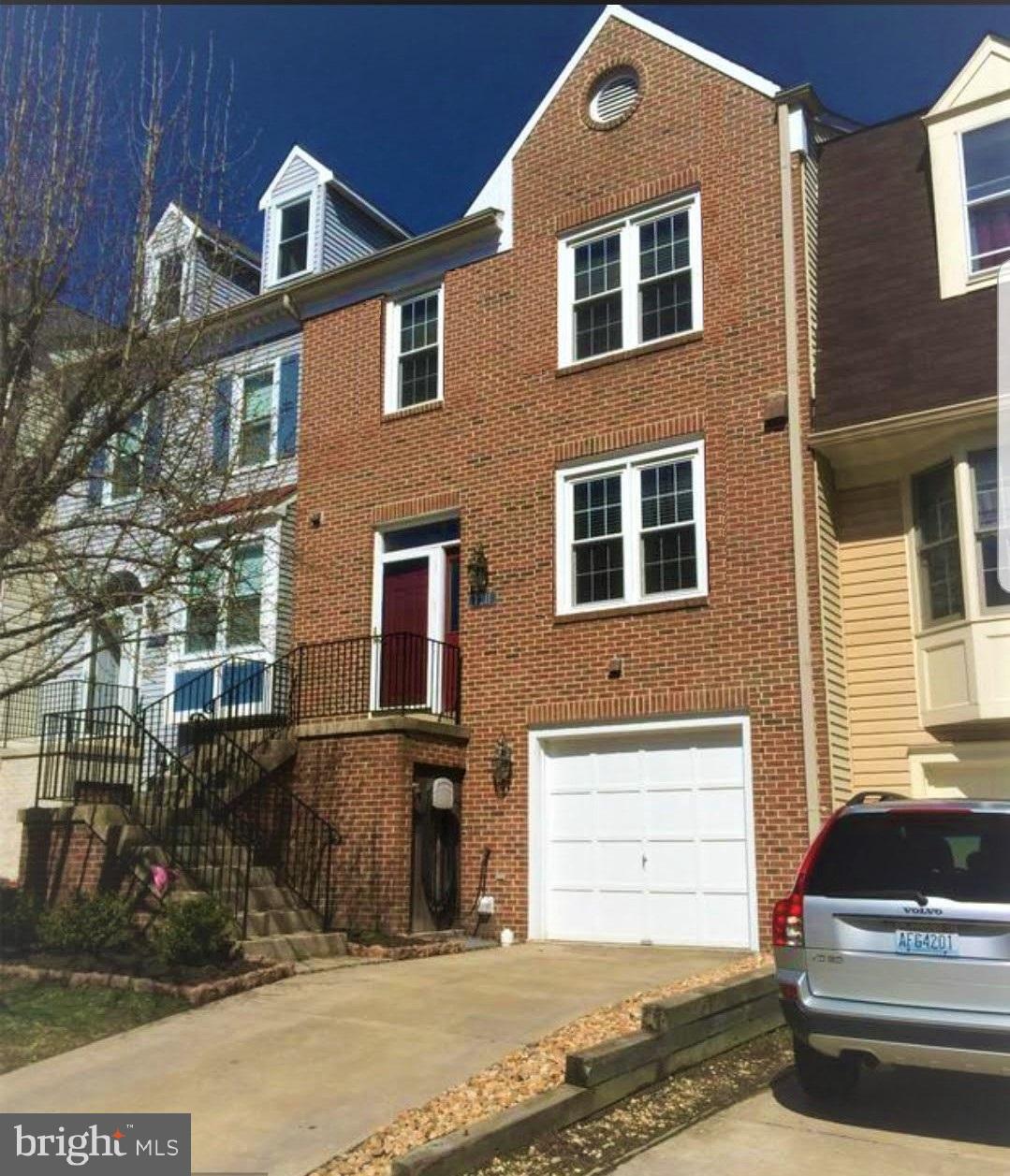 7211 Squirrel Run Court Springfield, VA 22152 - Photo 1 of 30 a front view of a house with a yard
