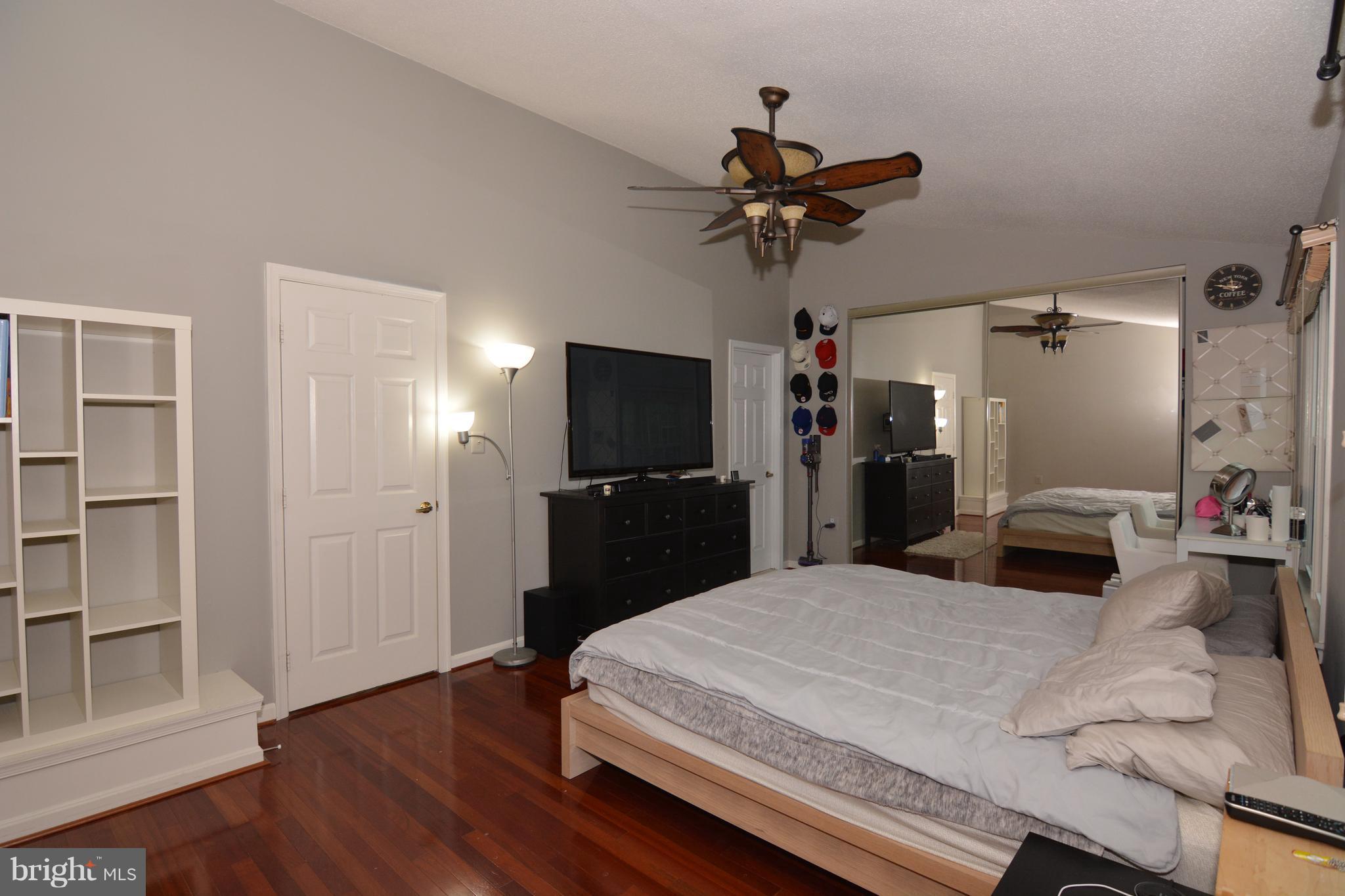 7211 Squirrel Run Court Springfield, VA 22152 - Photo 17 of 30 a bed room with a bed and a television