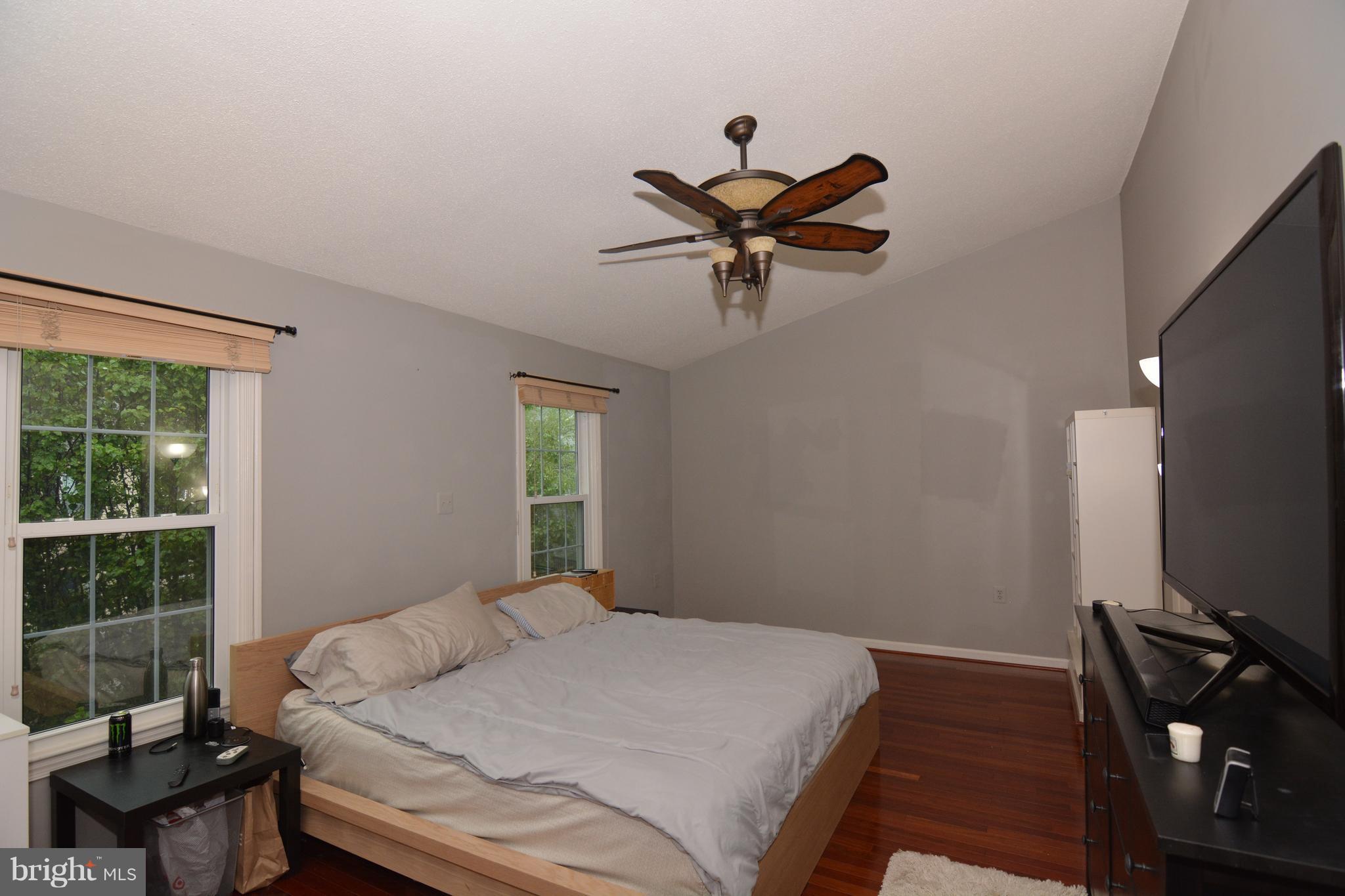 7211 Squirrel Run Court Springfield, VA 22152 - Photo 18 of 30 a bedroom with a bed and a window