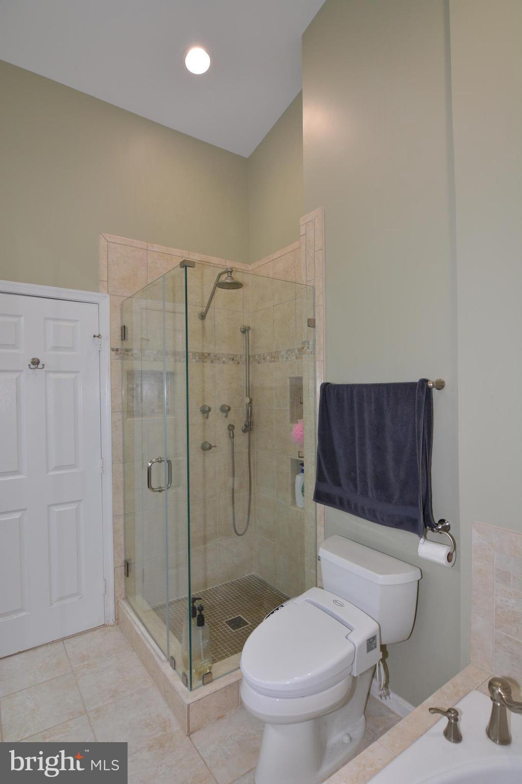 7211 Squirrel Run Court Springfield, VA 22152 - Photo 19 of 30 a bathroom with a toilet and a shower
