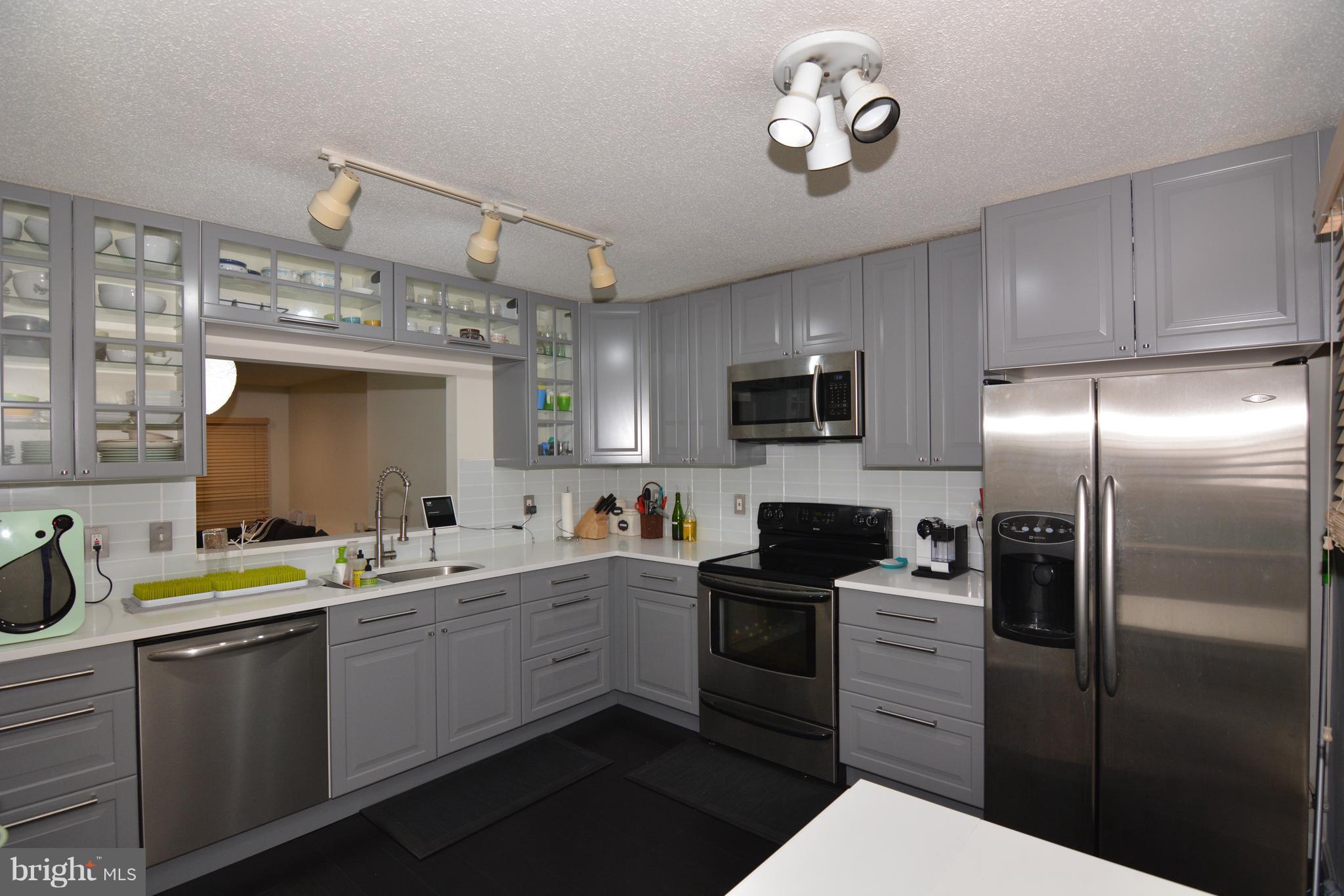 7211 Squirrel Run Court Springfield, VA 22152 - Photo 4 of 30 a kitchen with a sink appliances and cabinets