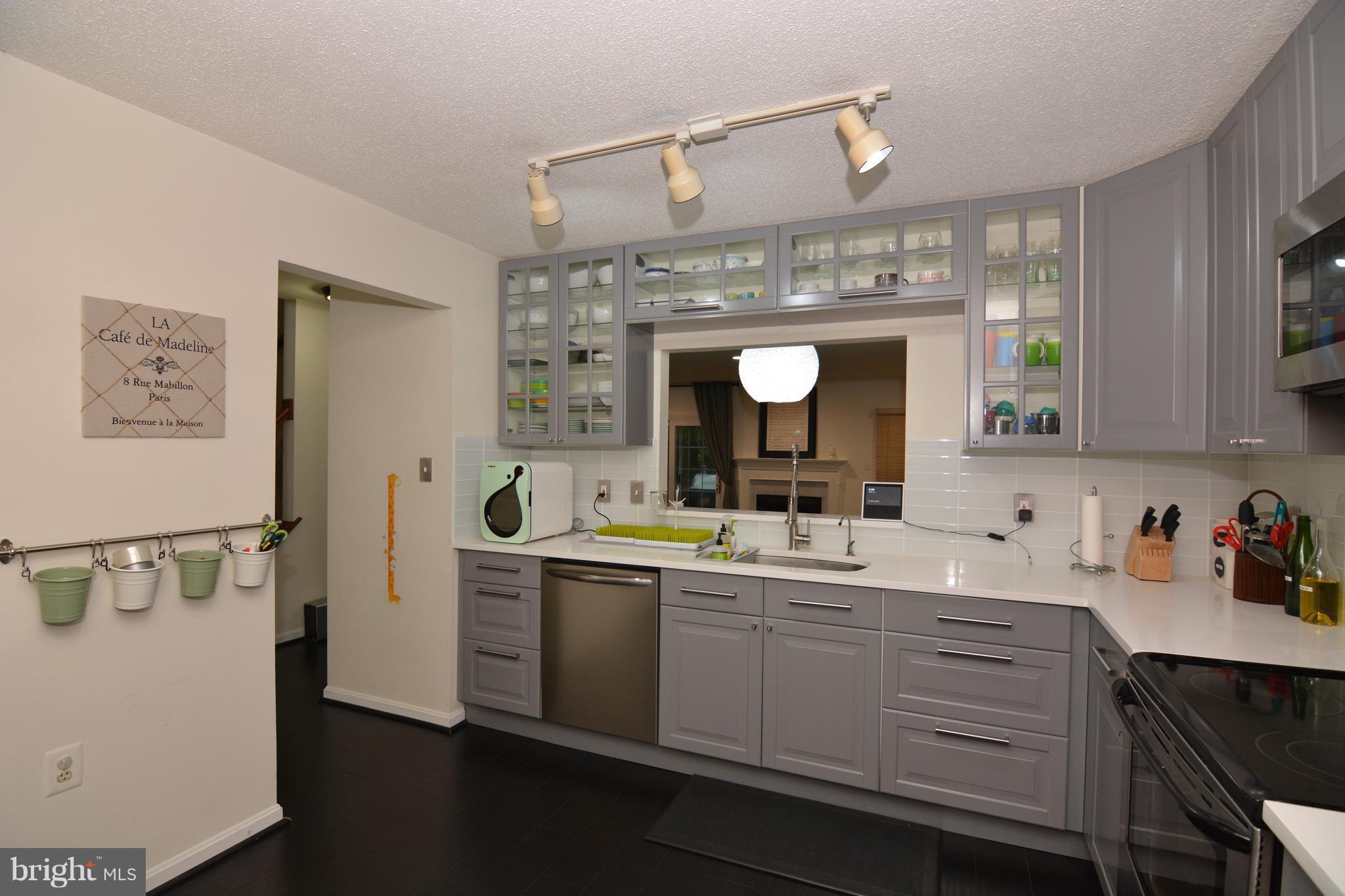 7211 Squirrel Run Court Springfield, VA 22152 - Photo 5 of 30 a kitchen with a sink and a refrigerator