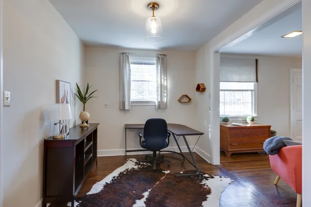 a workspace with furniture and a window