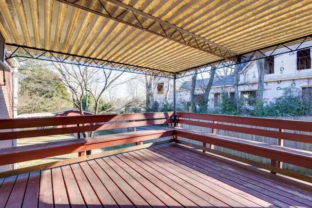 a sitting area with wooden deck