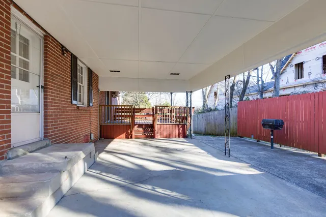 a view of a livingroom with furniture and a window