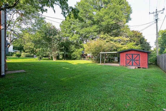 a view of a park with large trees