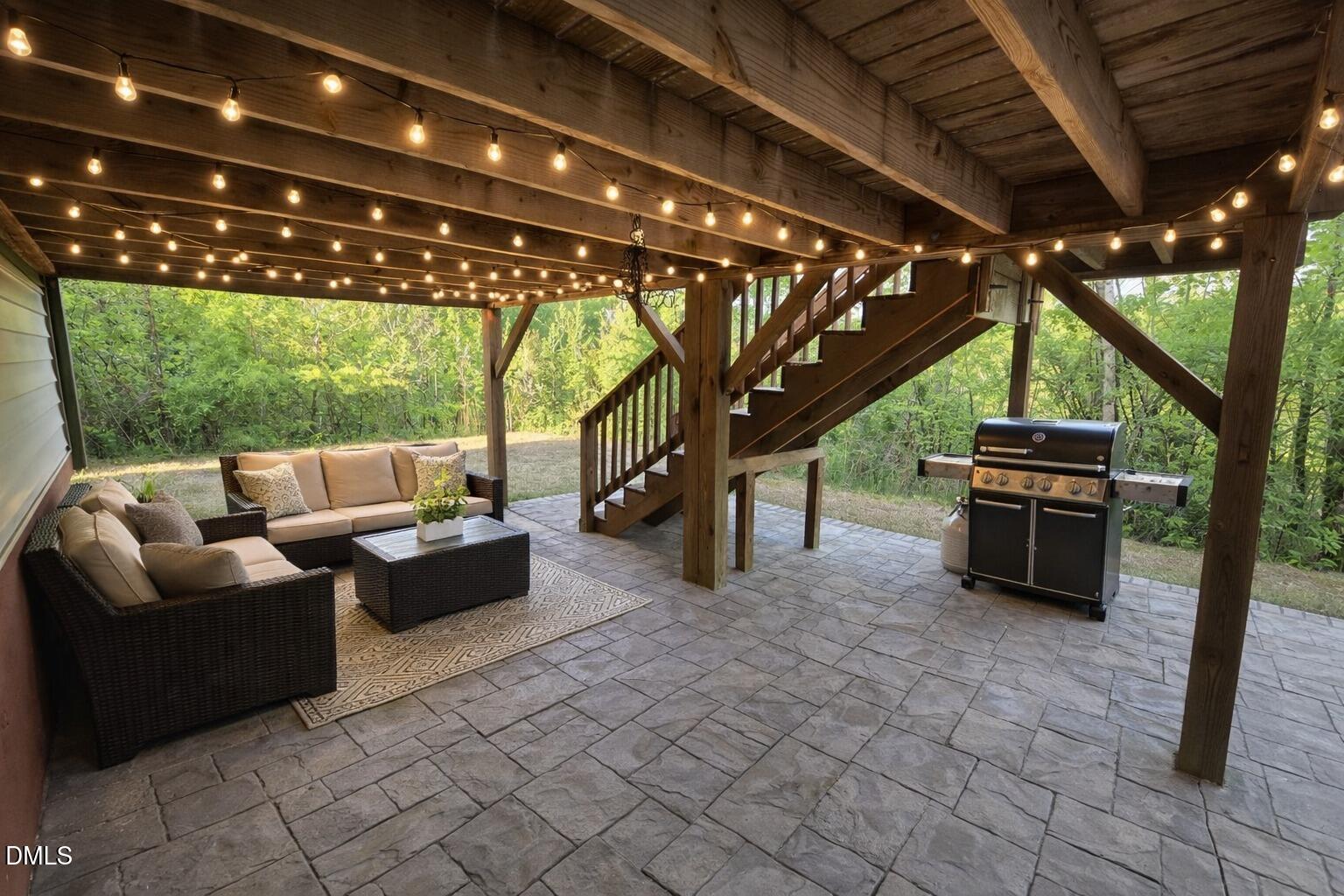 14303 Foxcroft Road Raleigh, NC 27614 - Photo 49 of 70 a living room with patio furniture and a grill