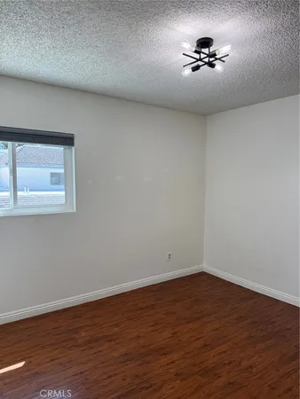 a view of an empty room with a fan