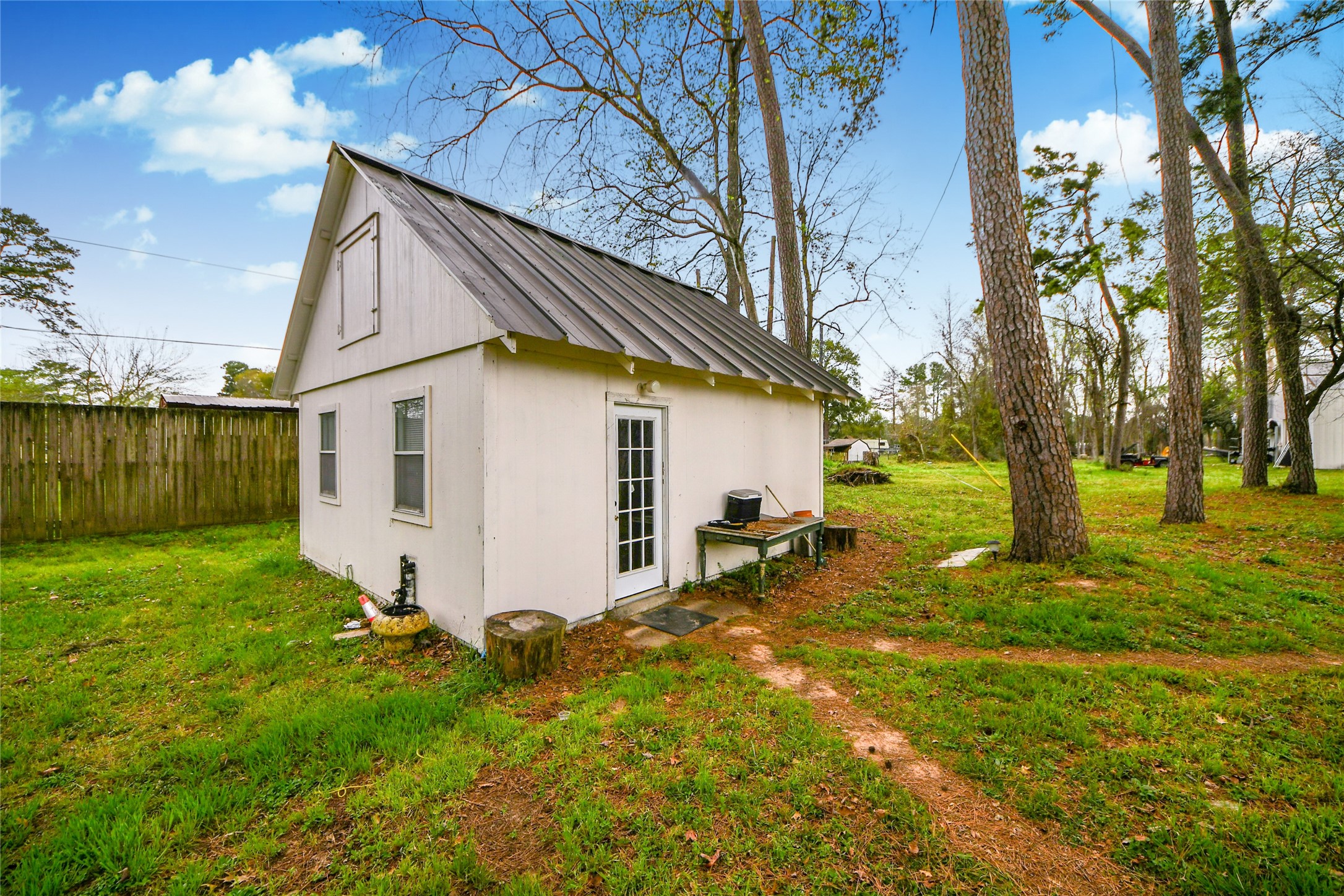 5310 Logston Lane Spring, TX 77389 - Photo 12 of 47 a view of a white house with a big yard and large tree