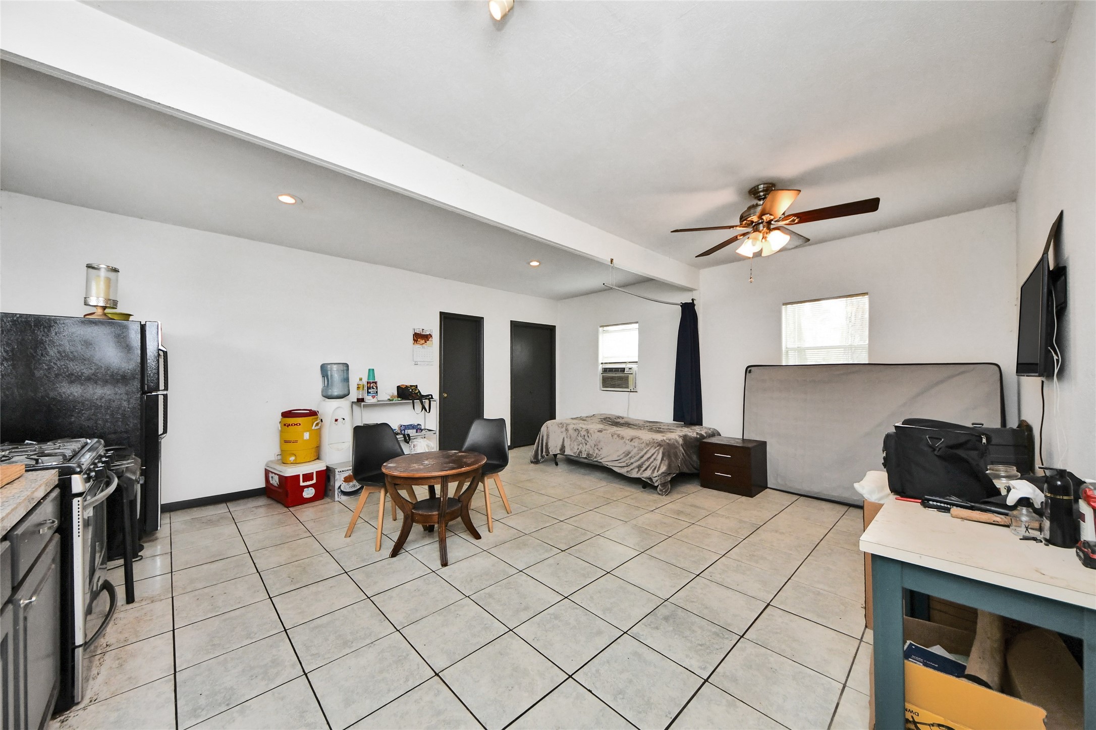 5310 Logston Lane Spring, TX 77389 - Photo 13 of 47 a living room with furniture and a flat screen tv