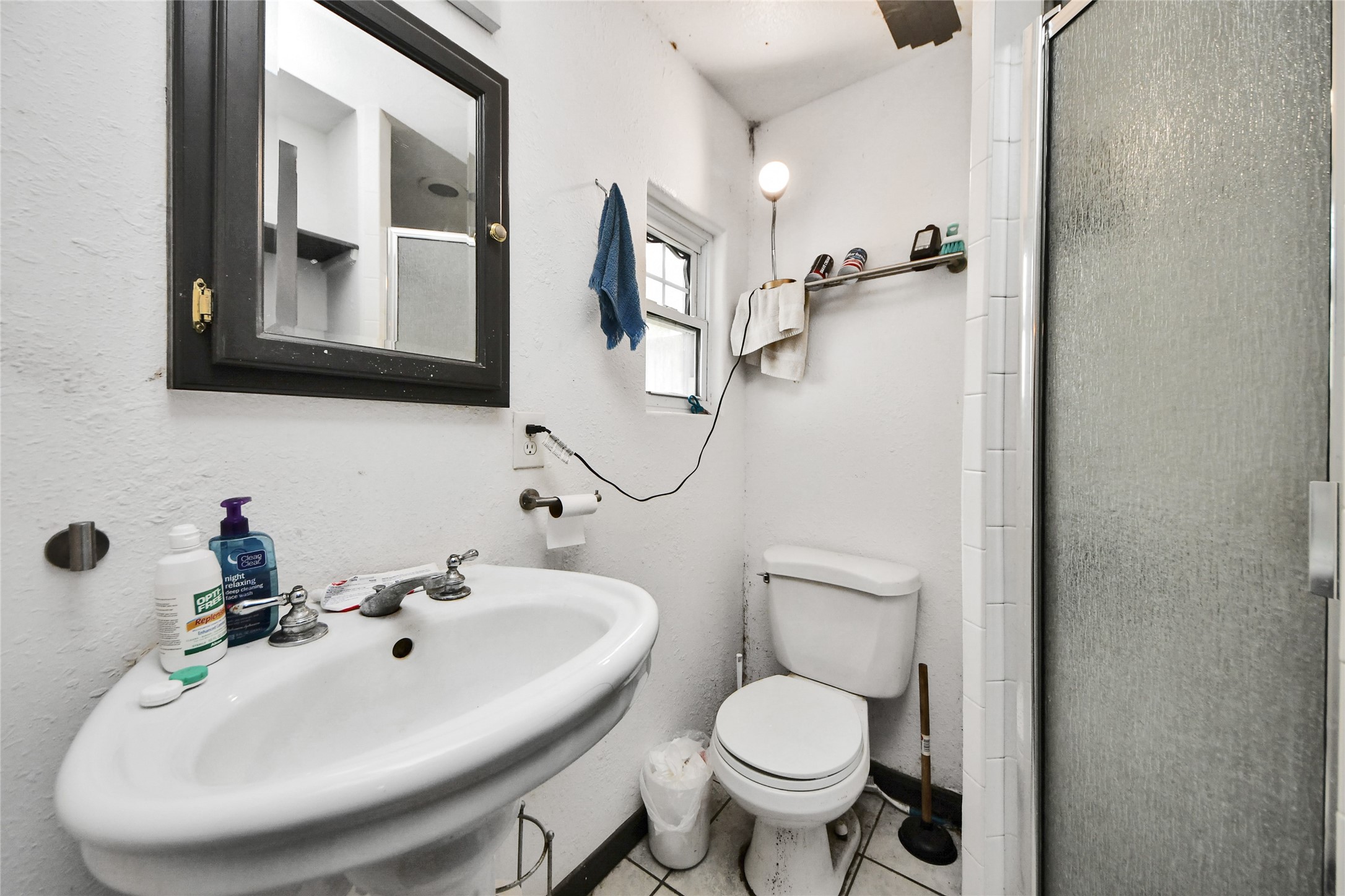 5310 Logston Lane Spring, TX 77389 - Photo 15 of 47 a bathroom with a toilet sink and mirror