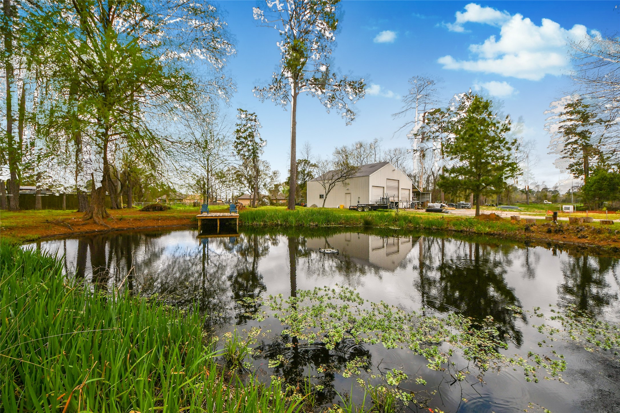 5310 Logston Lane Spring, TX 77389 - Photo 16 of 47 a view of a lake with a house in the background