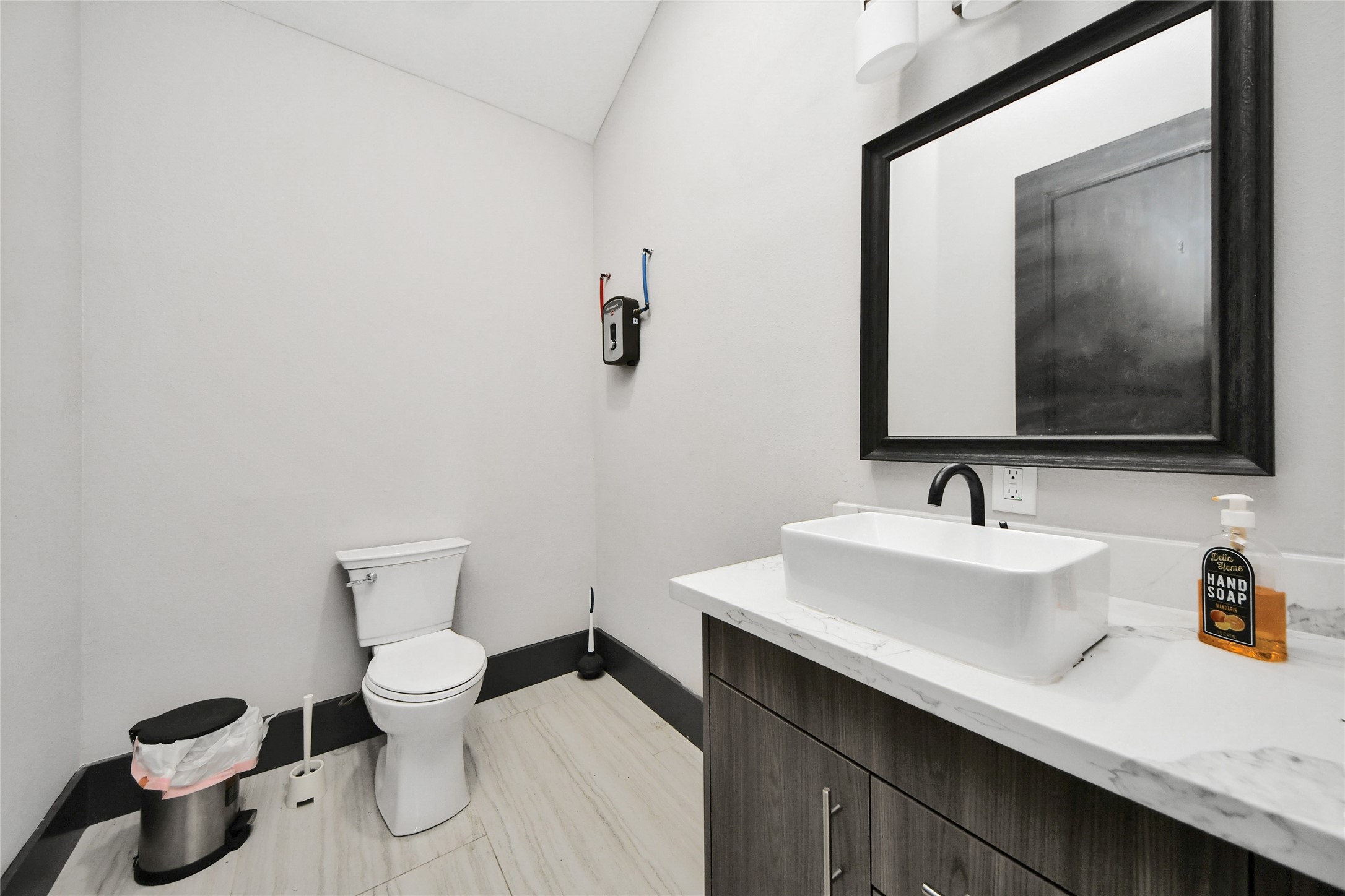 5310 Logston Lane Spring, TX 77389 - Photo 34 of 47 a bathroom with a toilet sink and mirror