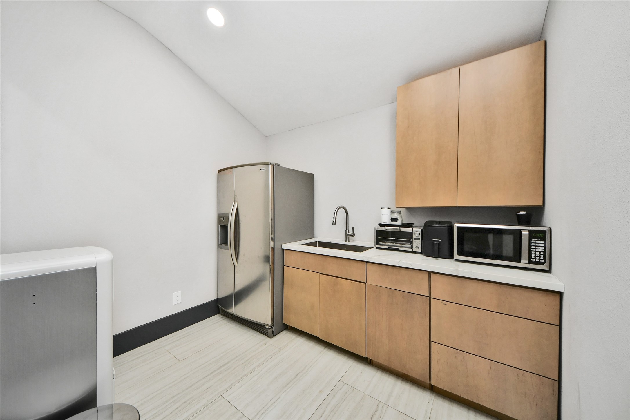 5310 Logston Lane Spring, TX 77389 - Photo 35 of 47 a kitchen with stainless steel appliances a refrigerator and a sink