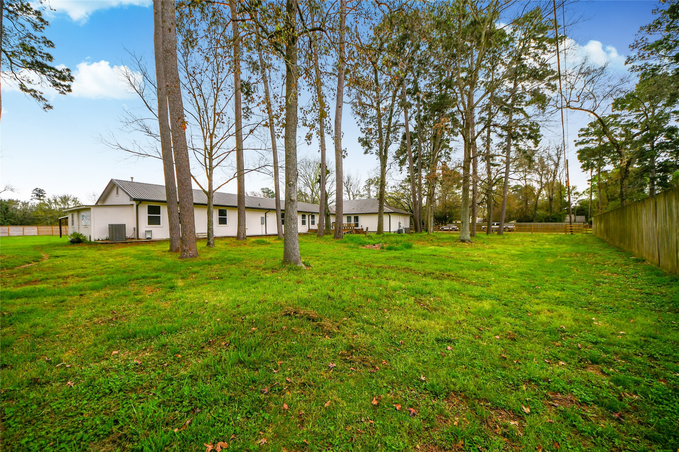 5310 Logston Lane Spring, TX 77389 - Photo 6 of 47 a view of a house with a big yard and large trees