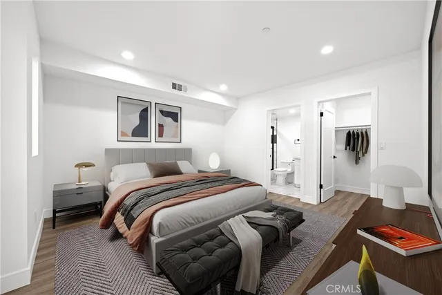 a bedroom with a bed and a desk