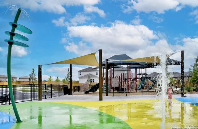 a view of a swimming pool with furniture