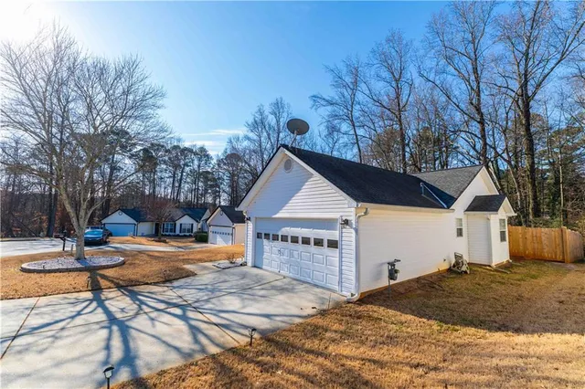 a view of a house with snow on the background