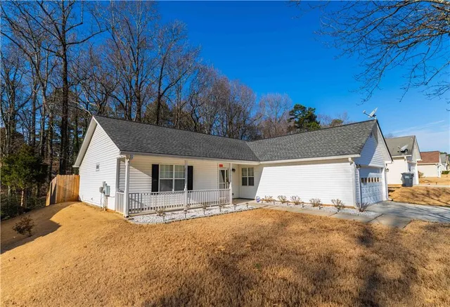 a view of house with yard and covered in snow