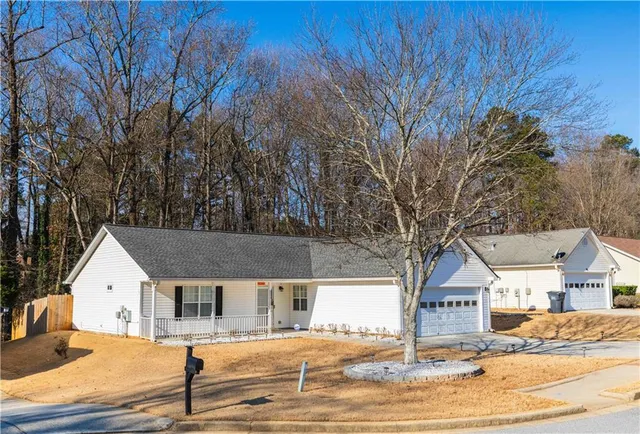 a view of a house with snow on the background