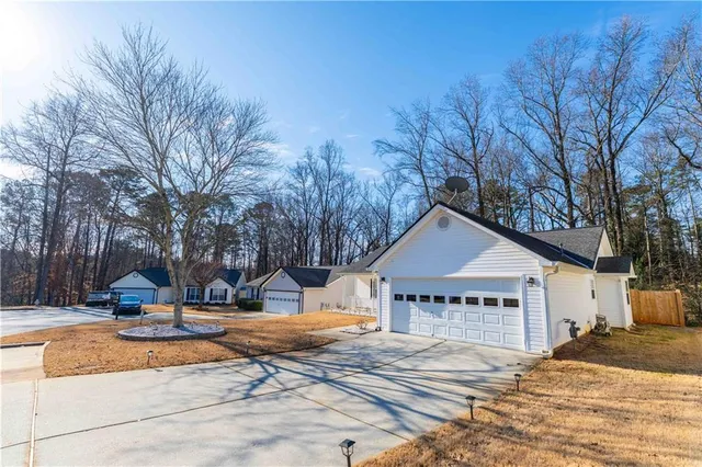a view of a house with snow on the background