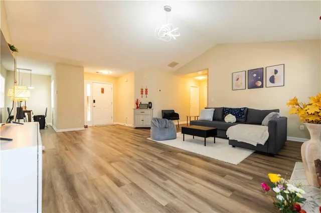 a living room with furniture and a table