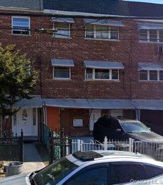 a front view of house with yard outdoor seating area and barbeque oven