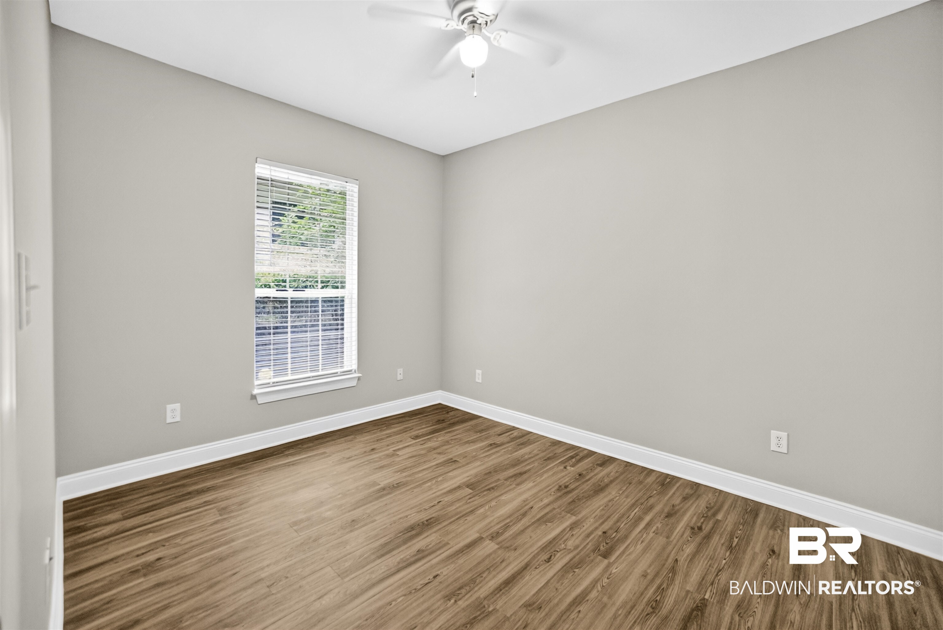 5913 Antoine Road Mobile, AL 36693 - Photo 20 of 33 Neutral wall tones with wood-finish flooring