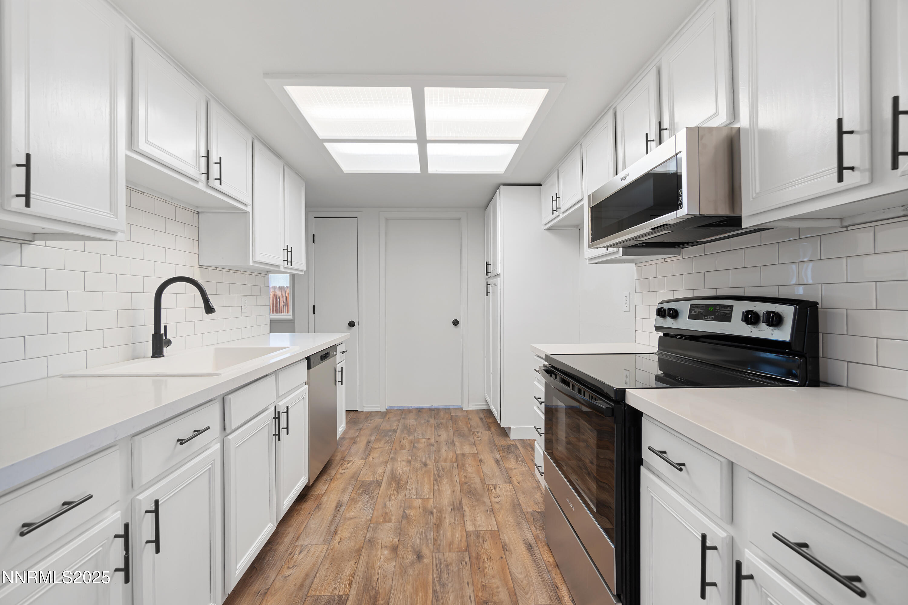 365 Kathy Street Fallon, NV 89406 - Photo 12 of 28 a kitchen with stainless steel appliances a sink dishwasher stove microwave and cabinets