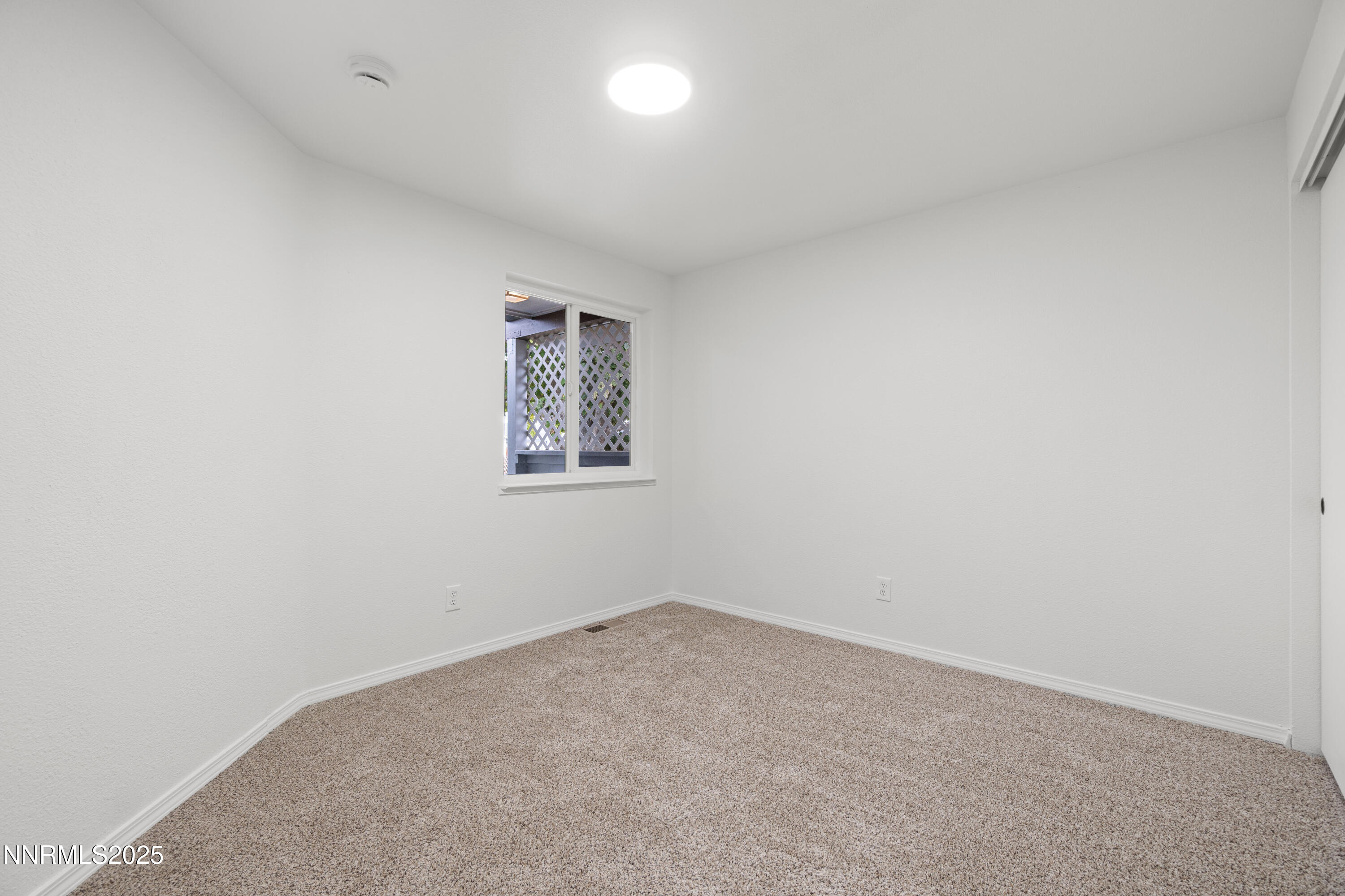 365 Kathy Street Fallon, NV 89406 - Photo 16 of 28 an empty room with a empty space and window