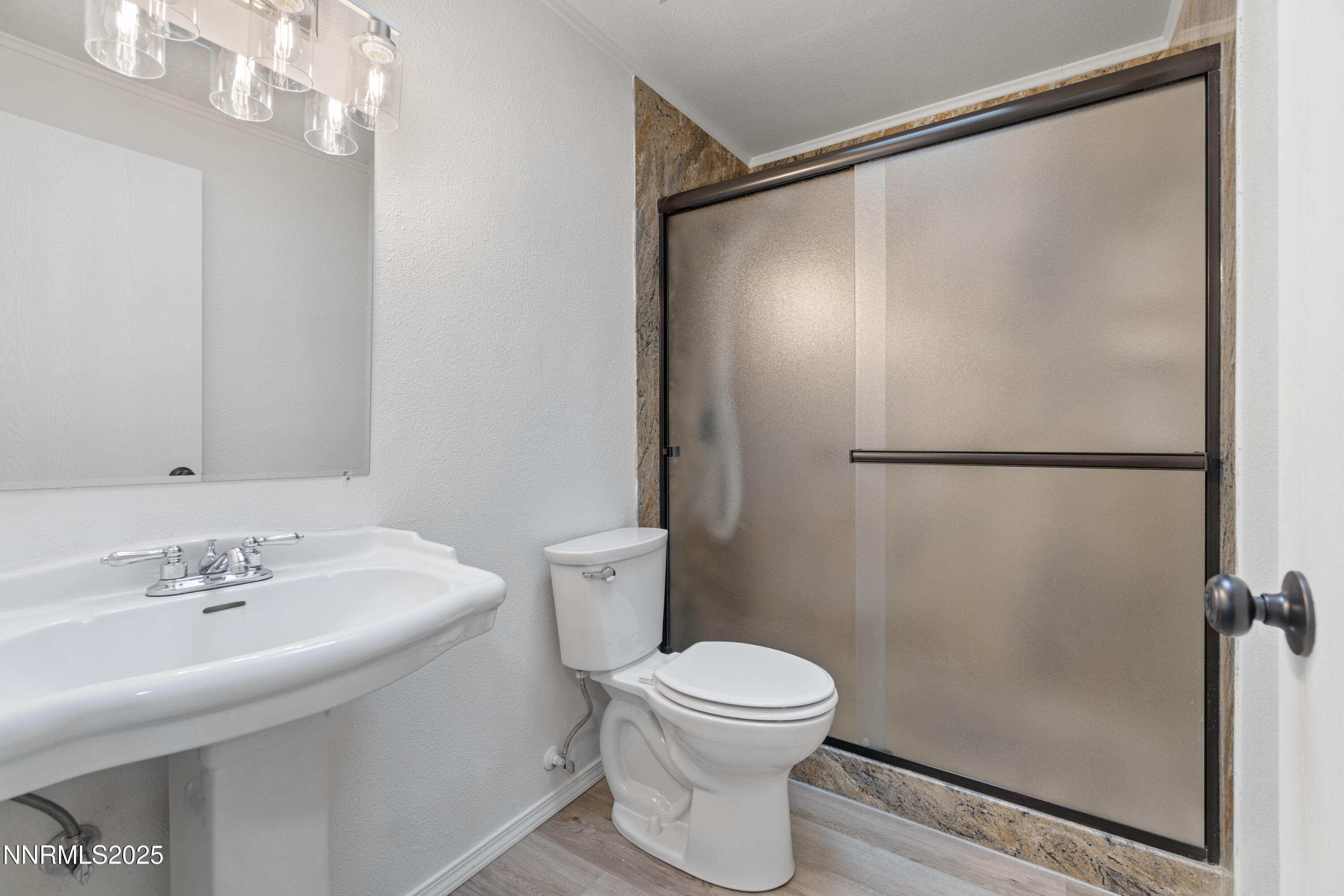 365 Kathy Street Fallon, NV 89406 - Photo 18 of 28 a white toilet sitting next to a bathroom sink