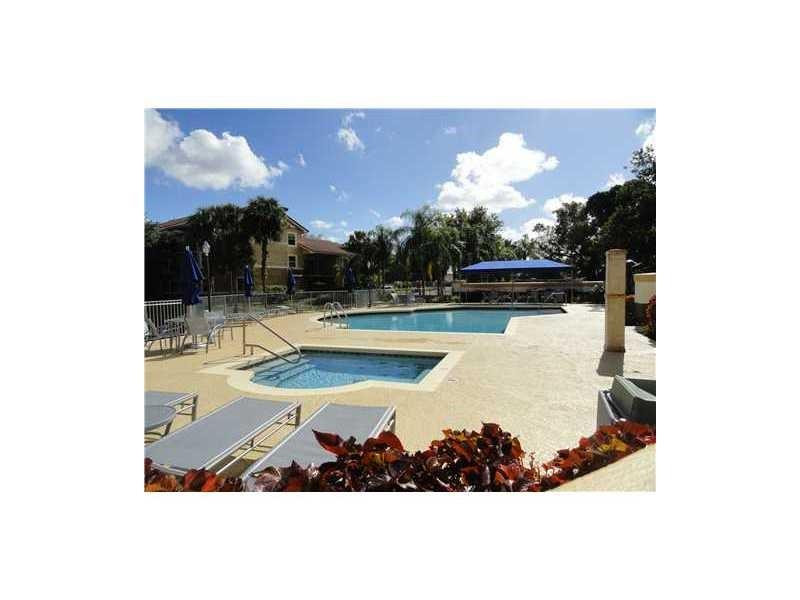 9001 Wiles Road, Unit 1033 Coral Springs, FL 33067 - Photo 11 of 11 a view of a swimming pool with an outdoor space
