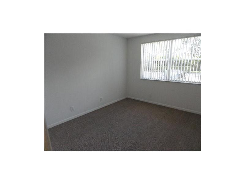 9001 Wiles Road, Unit 1033 Coral Springs, FL 33067 - Photo 6 of 11 a picture of floor in a room