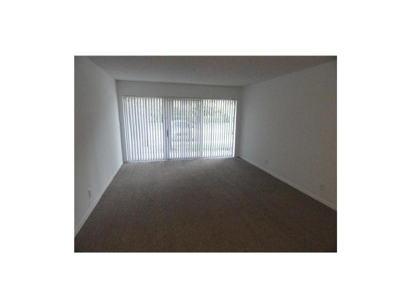 9001 Wiles Road, Unit 1033 Coral Springs, FL 33067 - Photo 8 of 11 a picture of floor plan