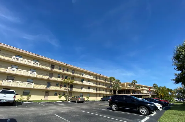 a view of building with car parked