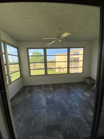 a view of an empty room and window