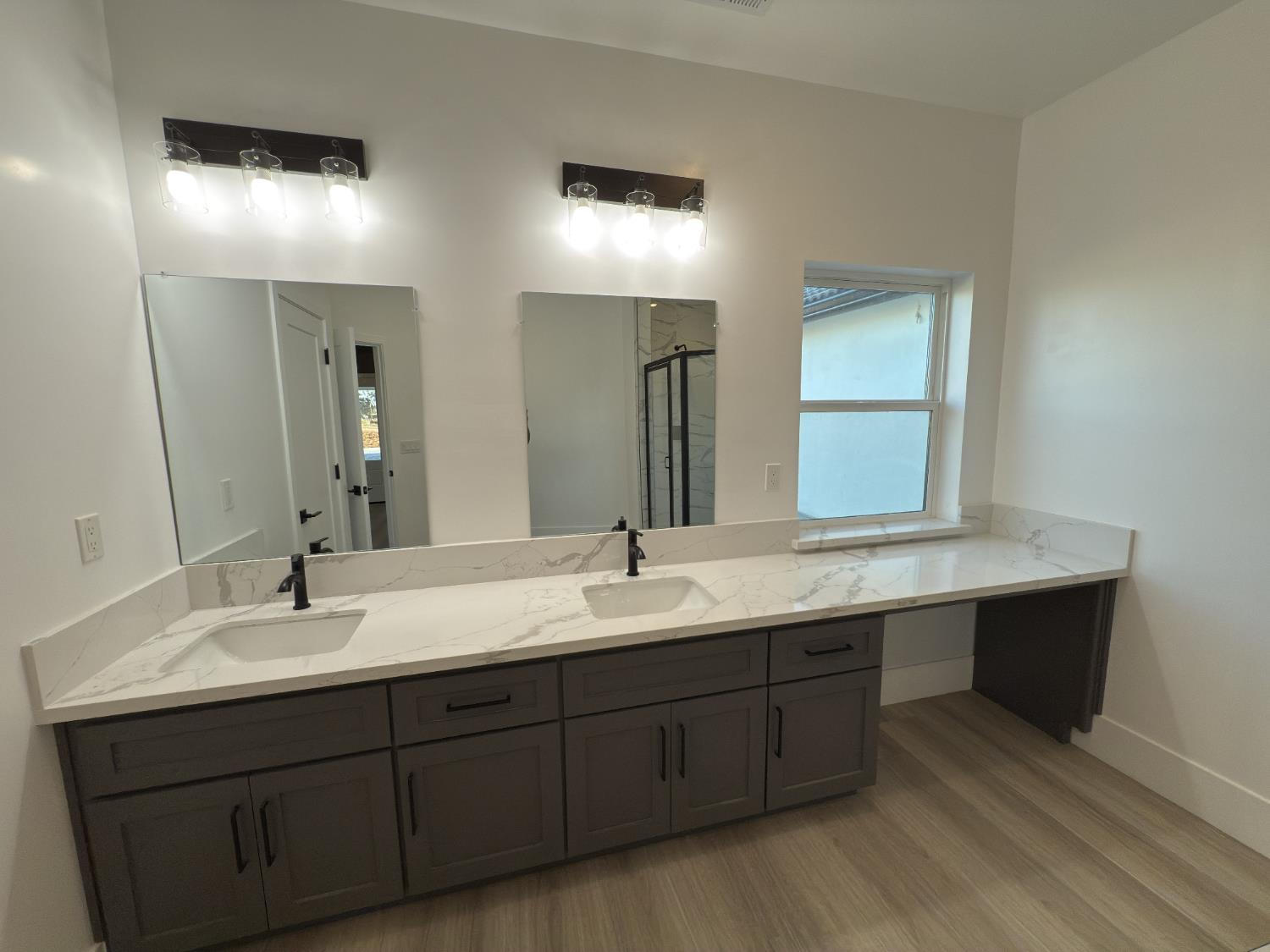 21275 Road 28 1/2 Madera, CA 93638 - Photo 18 of 28 a bathroom with double sink and a mirror