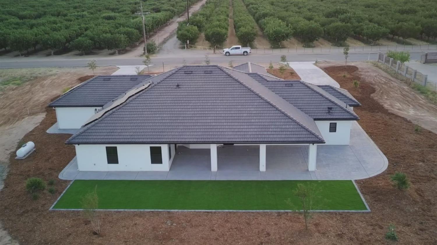 21275 Road 28 1/2 Madera, CA 93638 - Photo 2 of 28 a aerial view of a house with yard