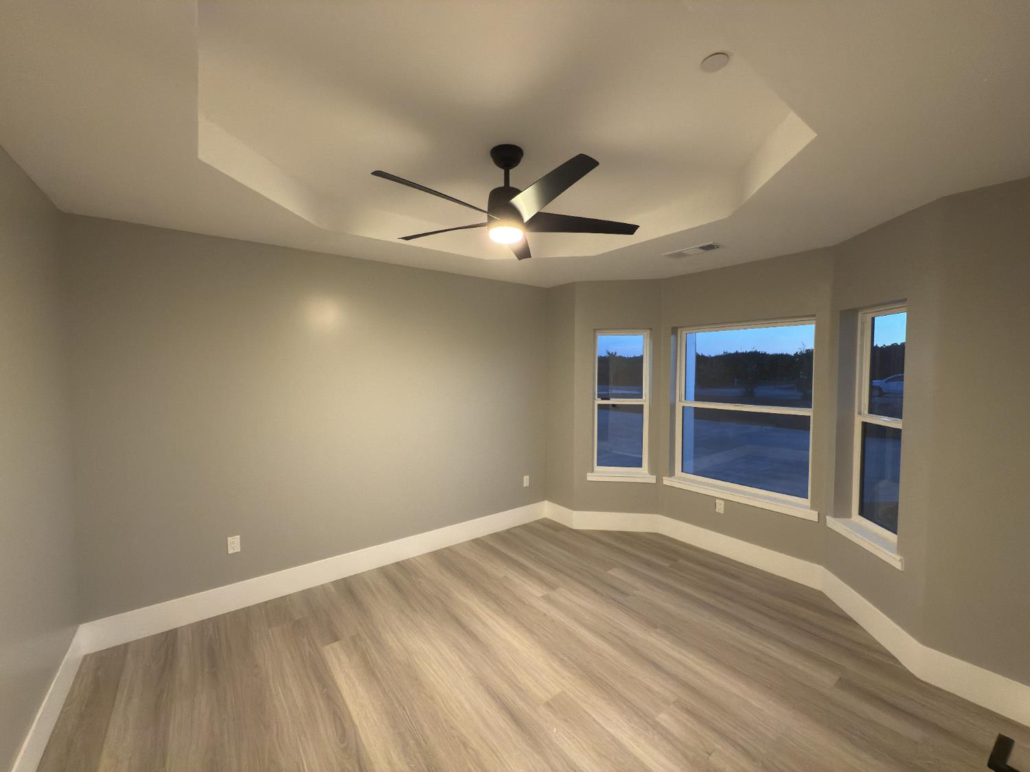 21275 Road 28 1/2 Madera, CA 93638 - Photo 21 of 28 wooden floor in an empty room with a window