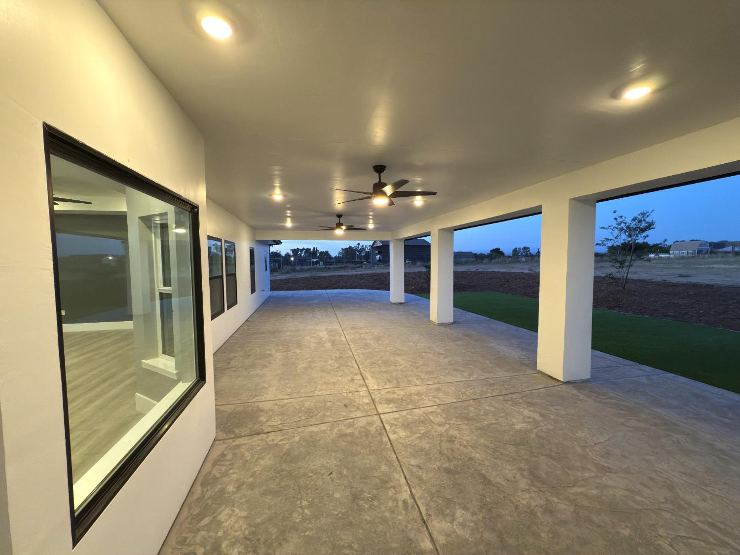 21275 Road 28 1/2 Madera, CA 93638 - Photo 6 of 28 a view of a hallway with an outdoor space